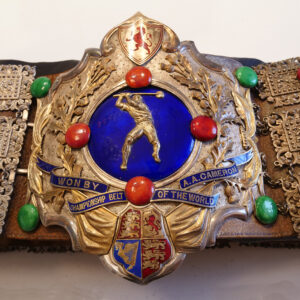 The brightly coloured belt that belonged to AA Cameron,  Gold with blue and red enamel