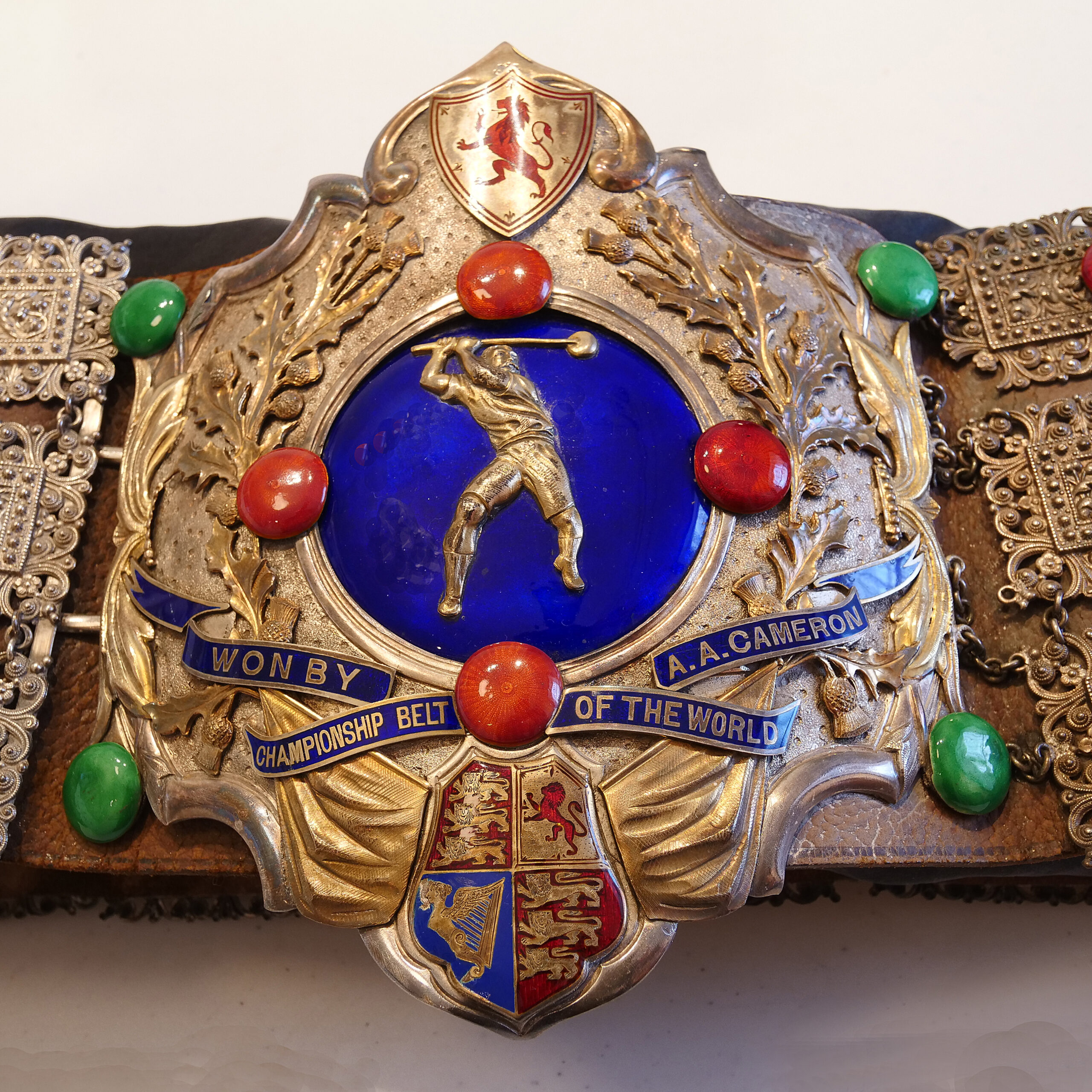 The brightly coloured belt that belonged to AA Cameron, Gold with blue and red enamel