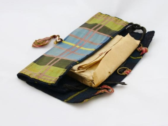 blue and green silk pouch in tartan pattern. Open at one end